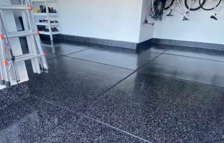 Before and after of a residential garage: concrete vs grey flake epoxy floor
