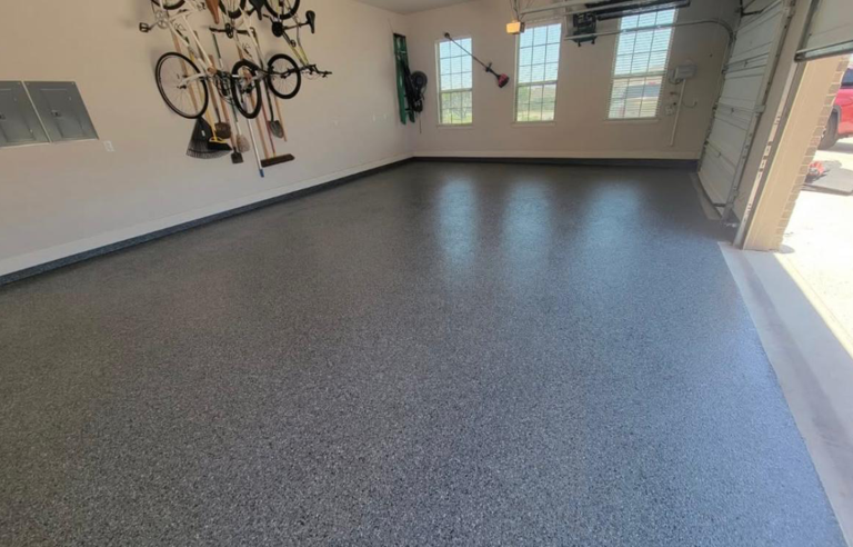 Before-and-after of workshop floor: dirty concrete vs. smooth gray epoxy coating