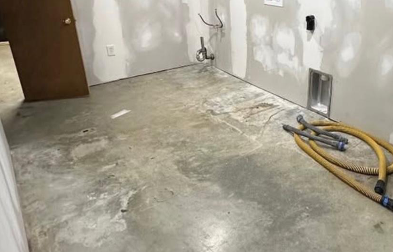 Before-and-after of basement floor: dull concrete vs. black and silver metallic epoxy